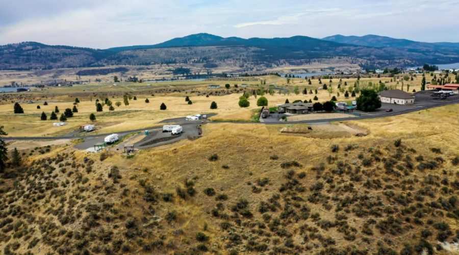 Aerial Photo of the Property with Mountains on the Background for Vista Views RV Lot with Water