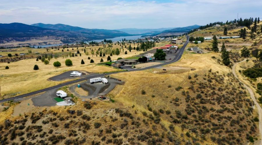 Aerial Photo of the Property with Mountains on the Background for Vista Views RV Lot with Water 2